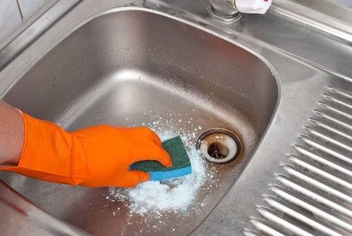 removing hard water stains from your stainless steel sink is a simple mixture of vinegar and baking soda
